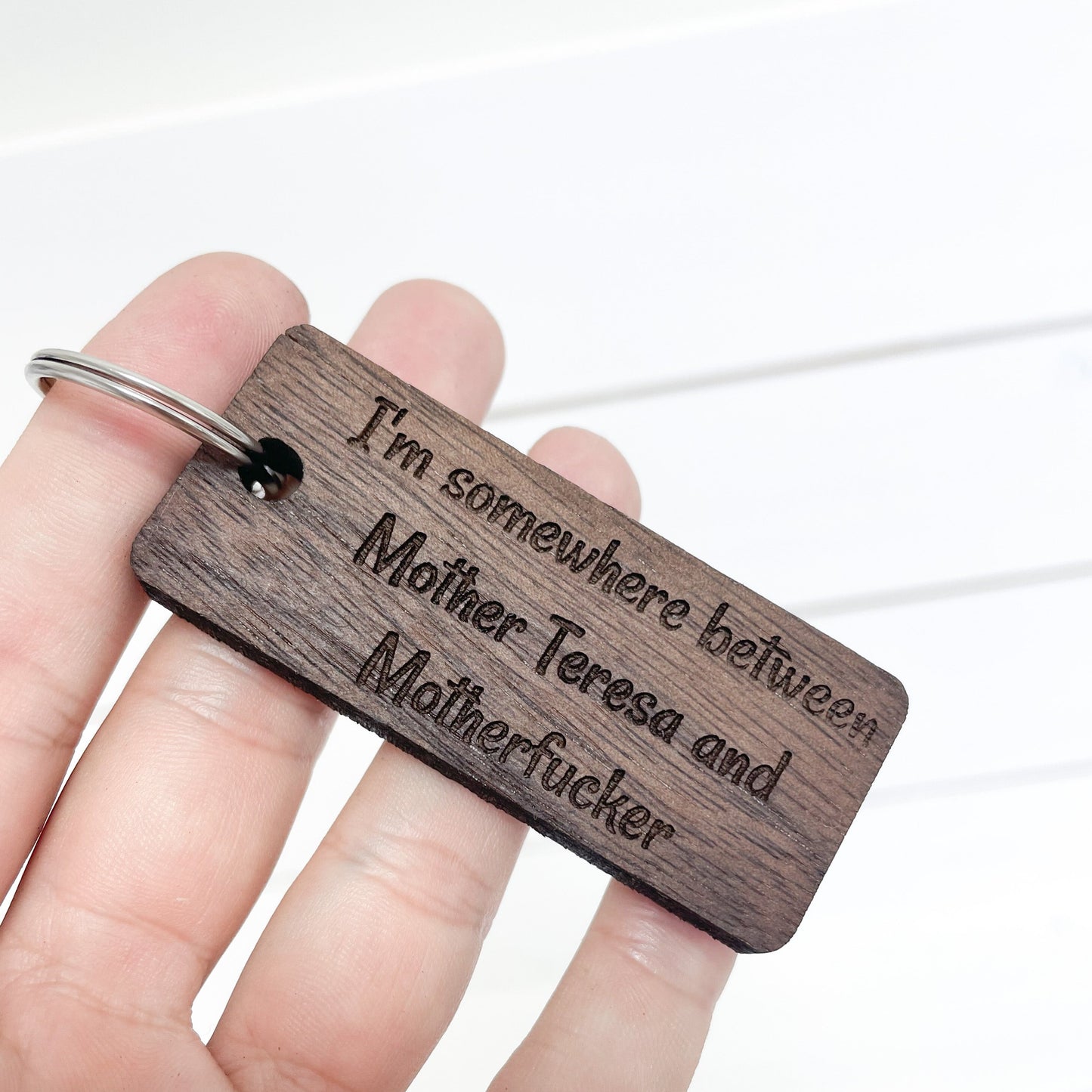 Somewhere between Mother Teresa & Mother F* walnut keychain.