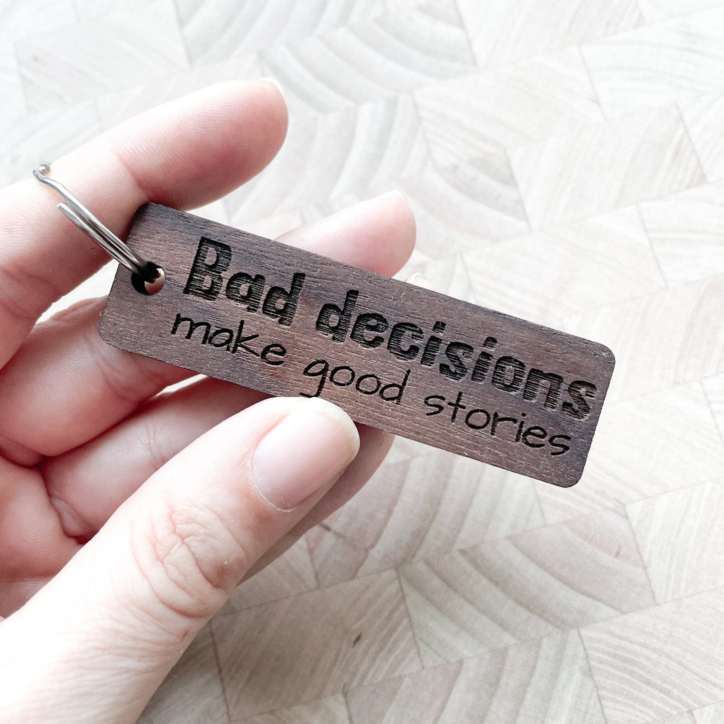 Bad decisions make good stories walnut keychain.