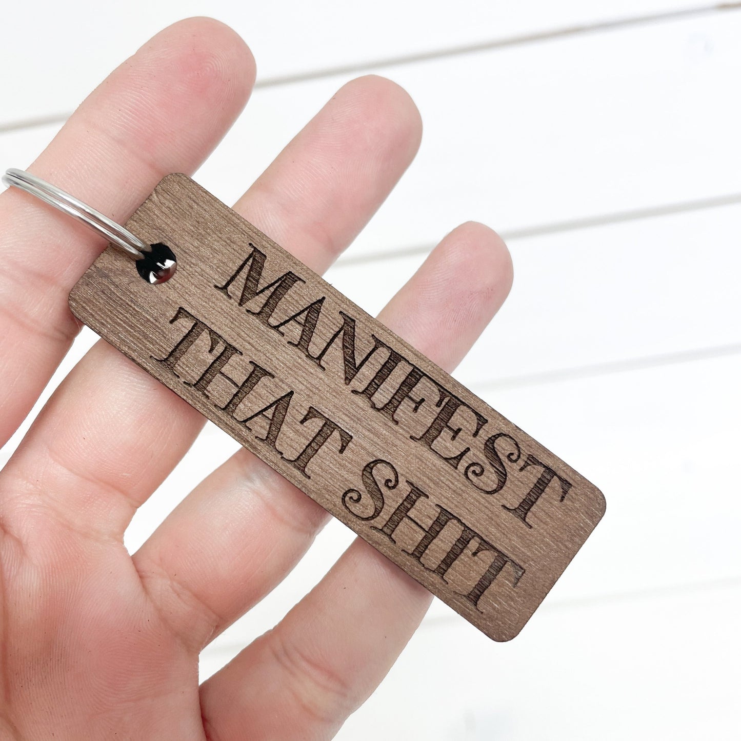 Manifest that Sh!t walnut keychain.