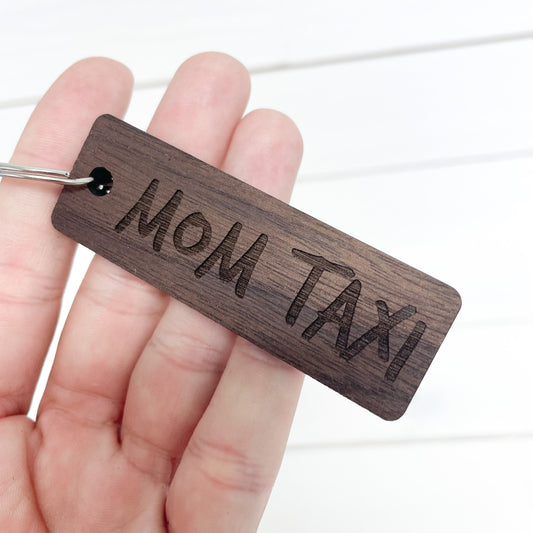 Mom Taxi walnut keychain.