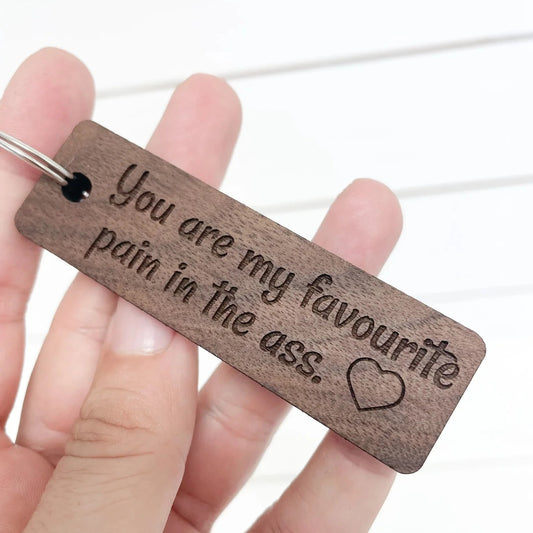 You are my Fave Pain in the Ass walnut keychain.